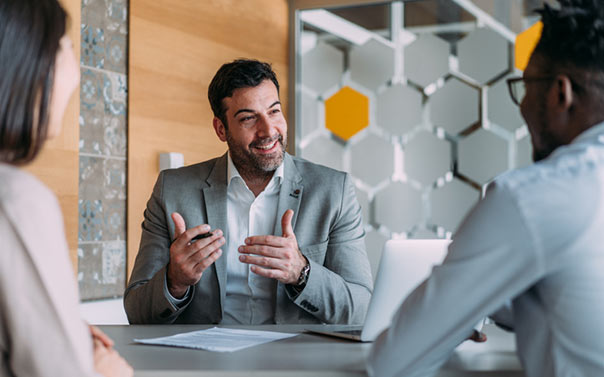 lawyer talking to two people